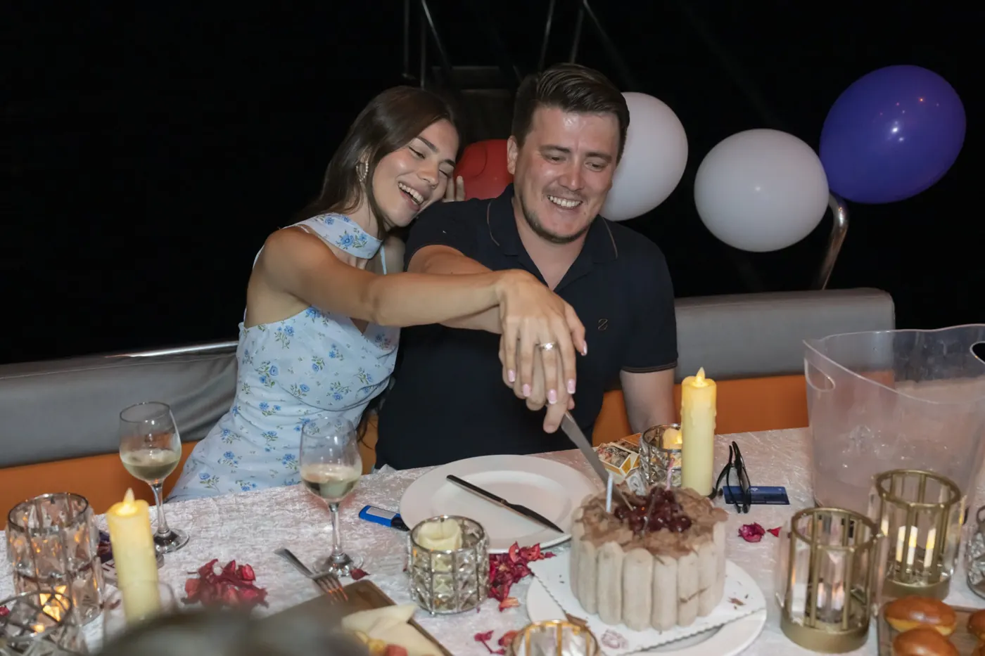 Celebration cake on a yacht dinner table