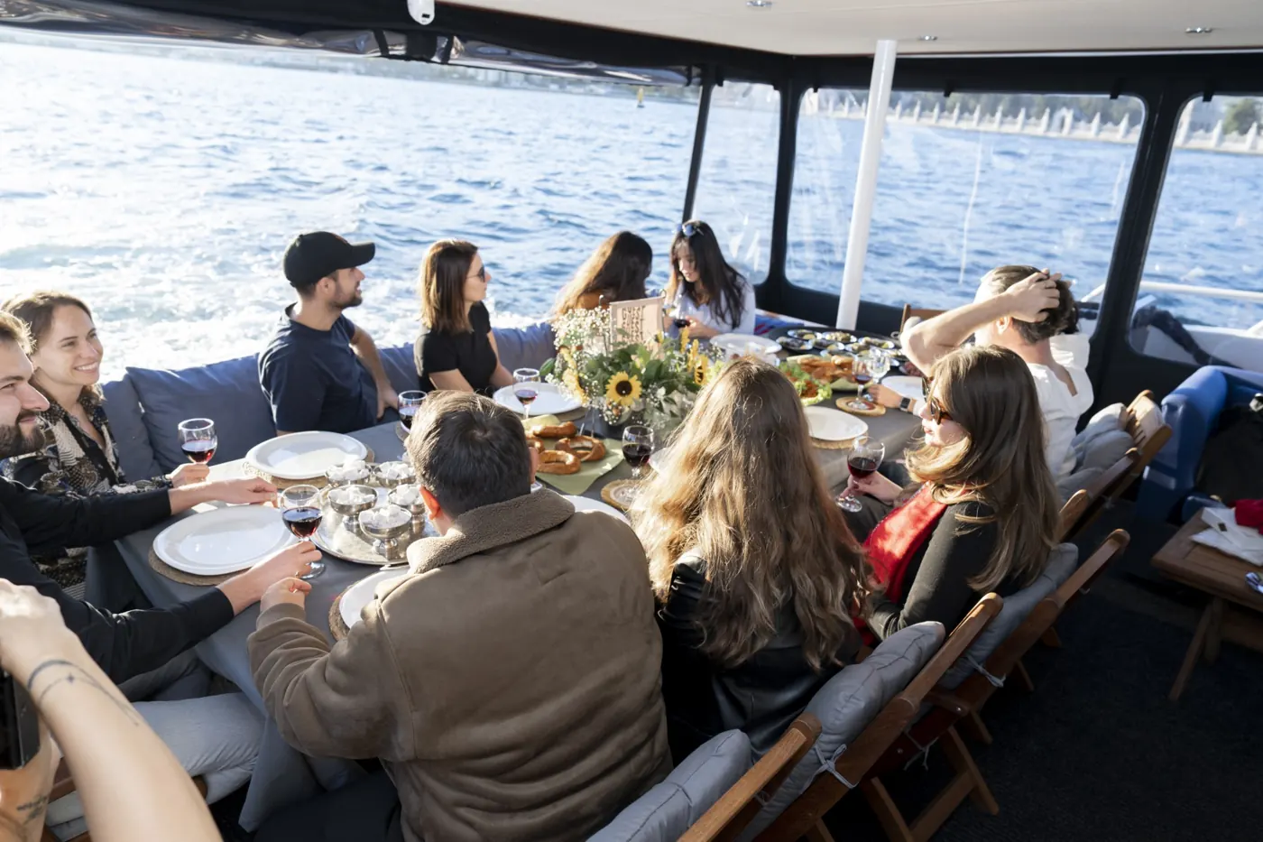 Friends having lunch on a yacht on the Bosphorus